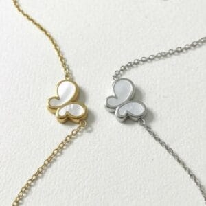pulsera acero con mariposa nacarada en dorado (baÑo en oro) y plateado